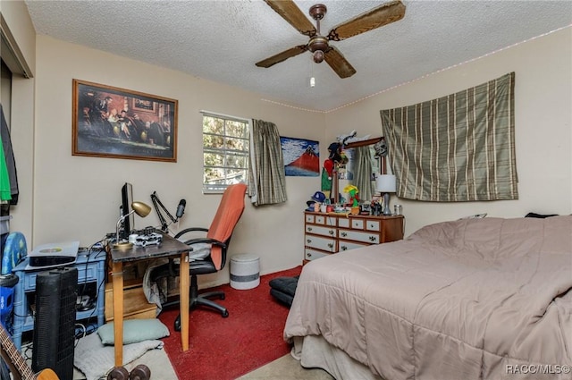 carpeted bedroom featuring ceiling fan and a textured ceiling