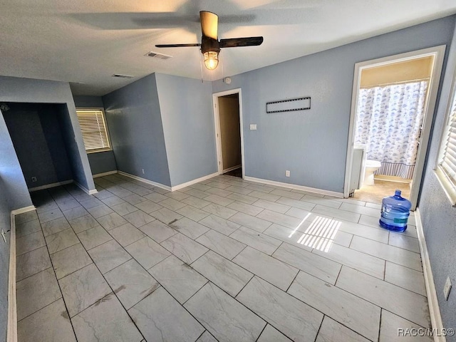 interior space featuring ceiling fan