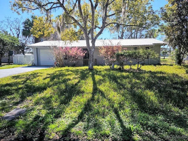 ranch-style house with a front lawn and a garage