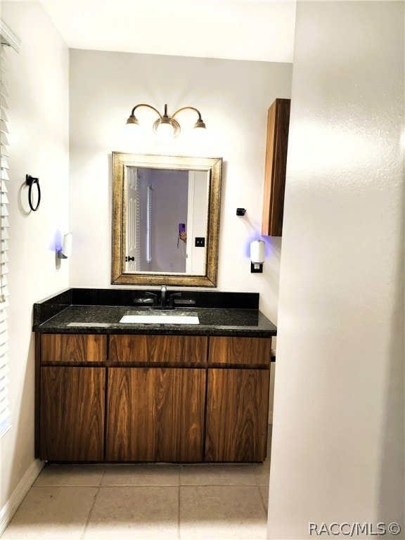 bathroom featuring tile patterned floors and vanity