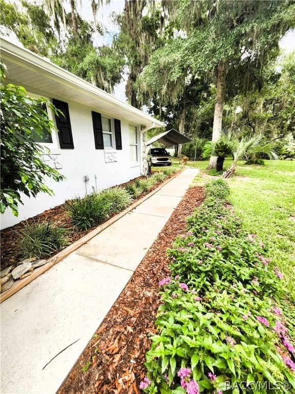 exterior space with a carport