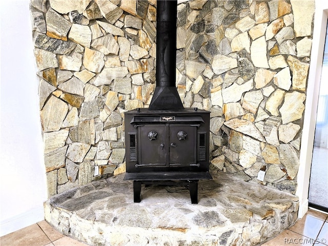 interior details featuring a wood stove