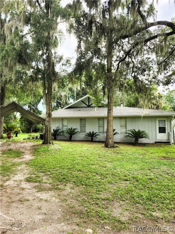 exterior space featuring a front lawn