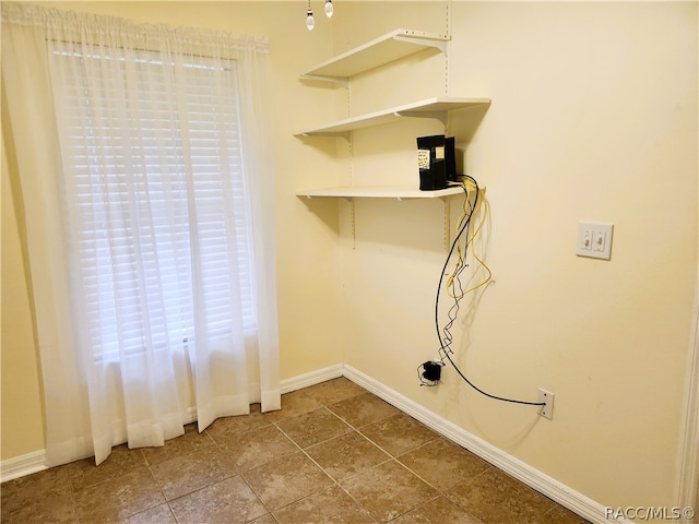 laundry room featuring tile patterned flooring