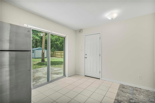 3410 N Bay Ave, Crystal River, FL 34428 - empty room with light tile patterned floors and baseboards