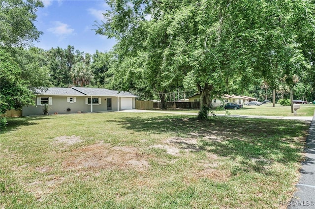 3410 N Bay Ave, Crystal River, FL 34428 - view of yard with an attached garage and driveway