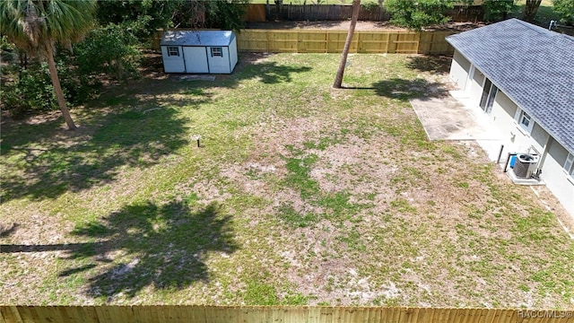 3410 N Bay Ave, Crystal River, FL 34428 - fenced backyard with a storage unit