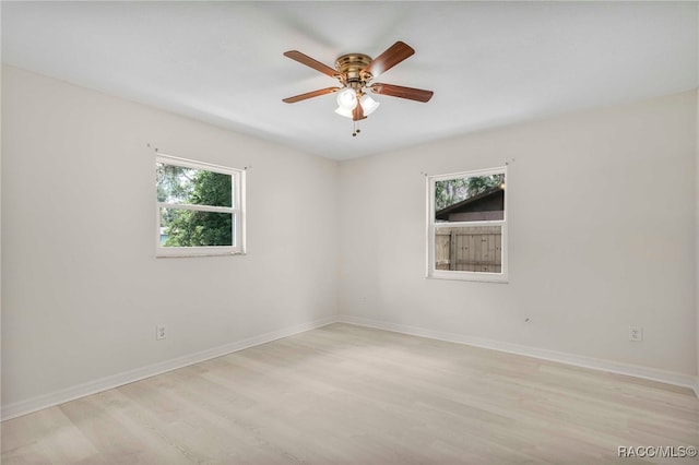 3410 N Bay Ave, Crystal River, FL 34428 - spare room featuring healthy amount of natural light, light wood finished floors, and ceiling fan