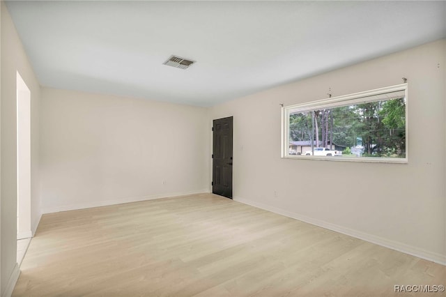 3410 N Bay Ave, Crystal River, FL 34428 - spare room featuring light wood finished floors and baseboards