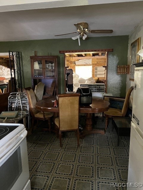 dining room featuring ceiling fan