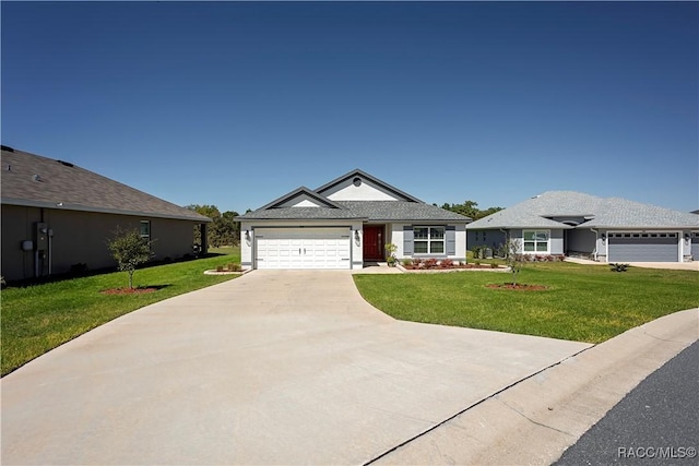 view of front of property featuring a garage, concrete driveway, and a front lawn