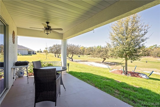 view of patio / terrace with outdoor dining space and ceiling fan