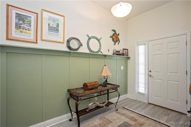 foyer featuring a healthy amount of sunlight and wood finished floors