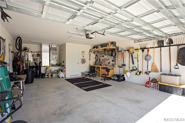 garage featuring a workshop area and a garage door opener