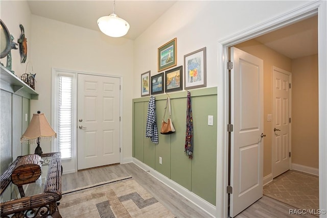 entrance foyer featuring light wood-style floors and baseboards