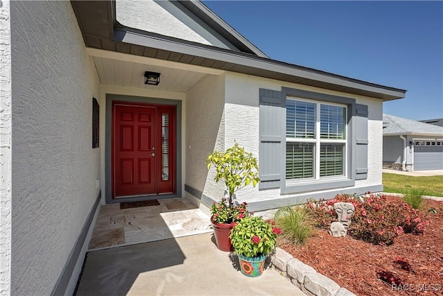 doorway to property with stucco siding