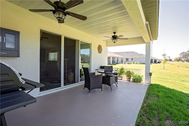 view of patio / terrace with outdoor dining space and ceiling fan