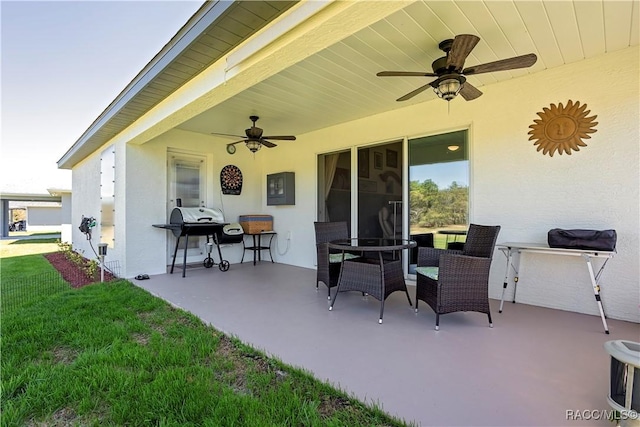 view of patio / terrace with area for grilling and ceiling fan