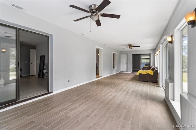 unfurnished sunroom featuring visible vents and a wealth of natural light