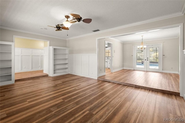 96 N Fresno Ave, Hernando, FL 34442 - unfurnished living room featuring dark wood-style floors, ceiling fan, a chandelier, ornamental molding, and french doors