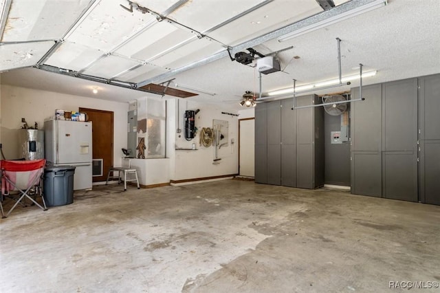 96 N Fresno Ave, Hernando, FL 34442 - garage featuring a garage door opener, water heater, and freestanding refrigerator