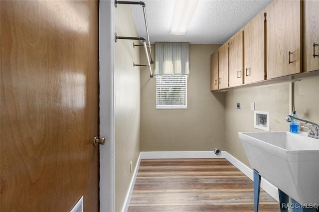 96 N Fresno Ave, Hernando, FL 34442 - laundry area featuring cabinet space, hookup for a washing machine, electric dryer hookup, wood finished floors, and a textured ceiling