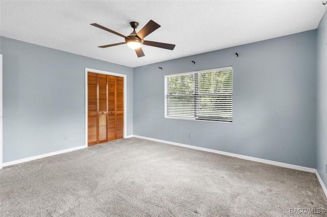 96 N Fresno Ave, Hernando, FL 34442 - unfurnished bedroom with carpet flooring, a closet, a ceiling fan, and a textured ceiling