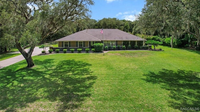 96 N Fresno Ave, Hernando, FL 34442 - view of front of home featuring a front lawn and concrete driveway