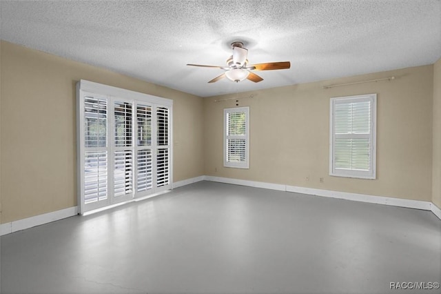 96 N Fresno Ave, Hernando, FL 34442 - spare room with finished concrete flooring, a ceiling fan, and a textured ceiling