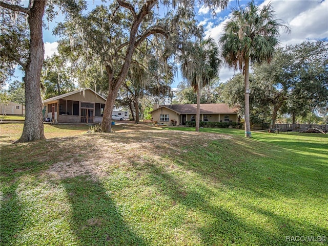 view of yard with a sunroom