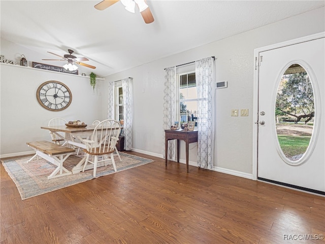 dining area with ceiling fan and dark hardwood / wood-style floors