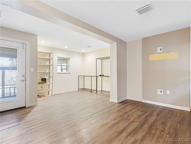 spare room featuring hardwood / wood-style flooring