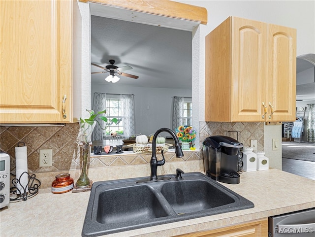 kitchen featuring tasteful backsplash, ceiling fan, light brown cabinetry, and sink