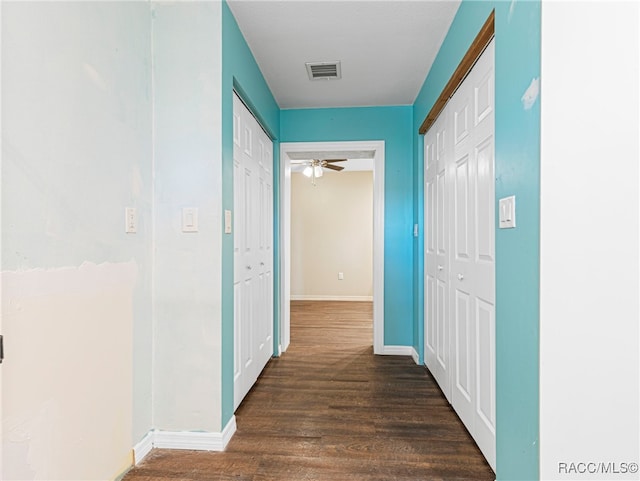 hallway featuring dark hardwood / wood-style floors