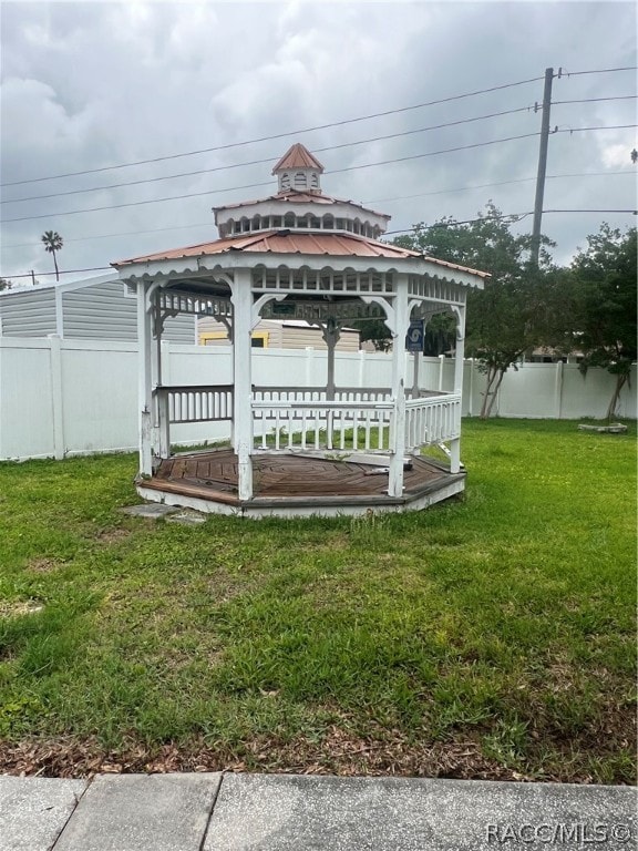 exterior space with a gazebo and a yard