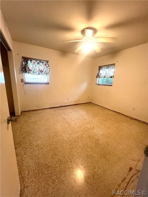 unfurnished room featuring ceiling fan