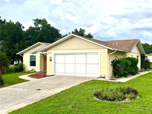 single story home with a front yard and a garage