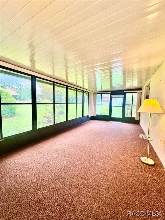 unfurnished sunroom featuring a healthy amount of sunlight