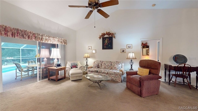 carpeted living room with ceiling fan and high vaulted ceiling