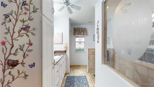 bathroom featuring ceiling fan and vanity