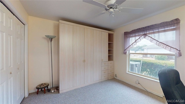 unfurnished bedroom featuring light carpet and ceiling fan