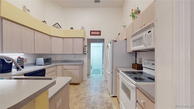 kitchen with sink and white appliances