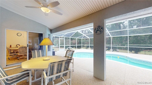 view of pool featuring ceiling fan