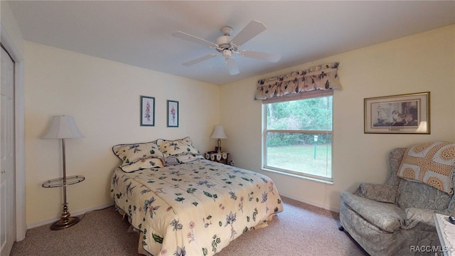 carpeted bedroom featuring ceiling fan