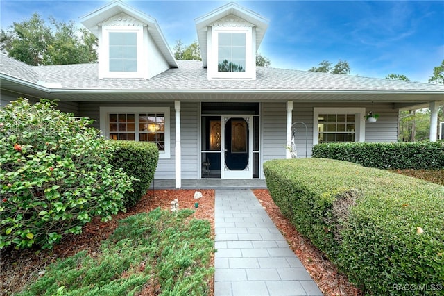 doorway to property with covered porch