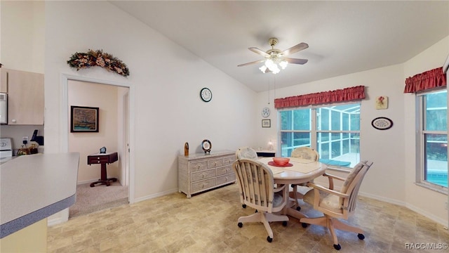 dining room with vaulted ceiling and ceiling fan