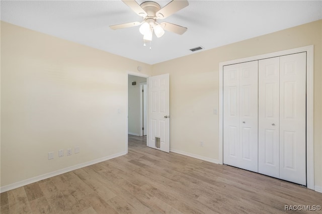 unfurnished bedroom with a closet, ceiling fan, and light hardwood / wood-style floors