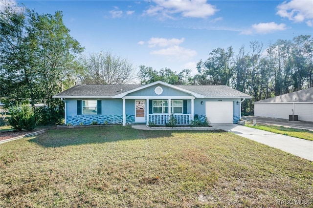 single story home featuring central air condition unit, a garage, a porch, and a front yard