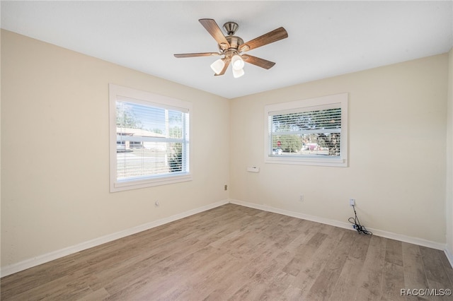 unfurnished room with light wood-type flooring and ceiling fan