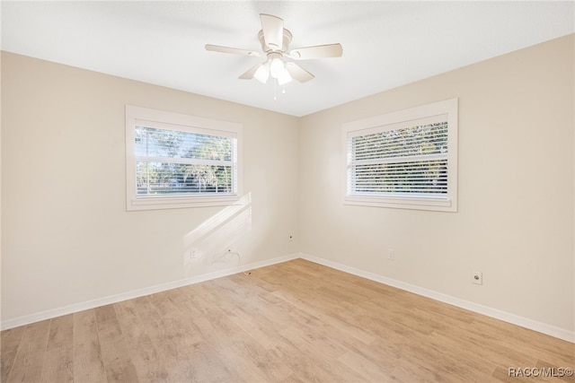 spare room featuring ceiling fan and light wood-type flooring